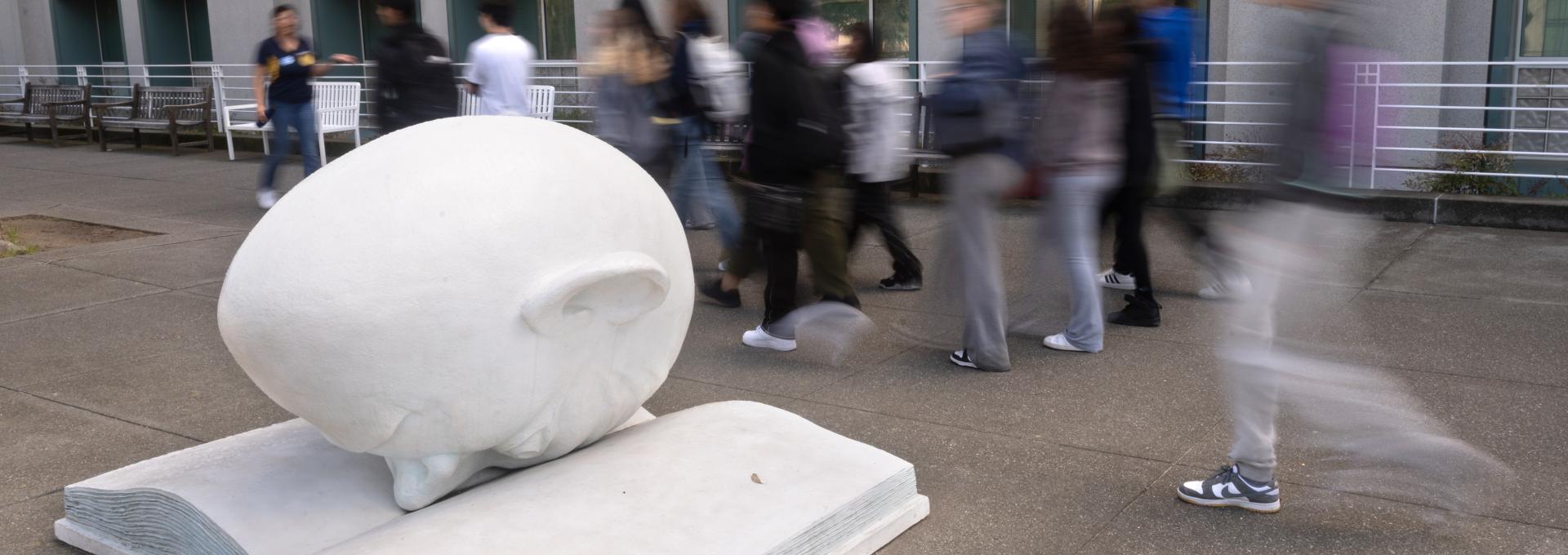 Egghead statue in front of Shields Library